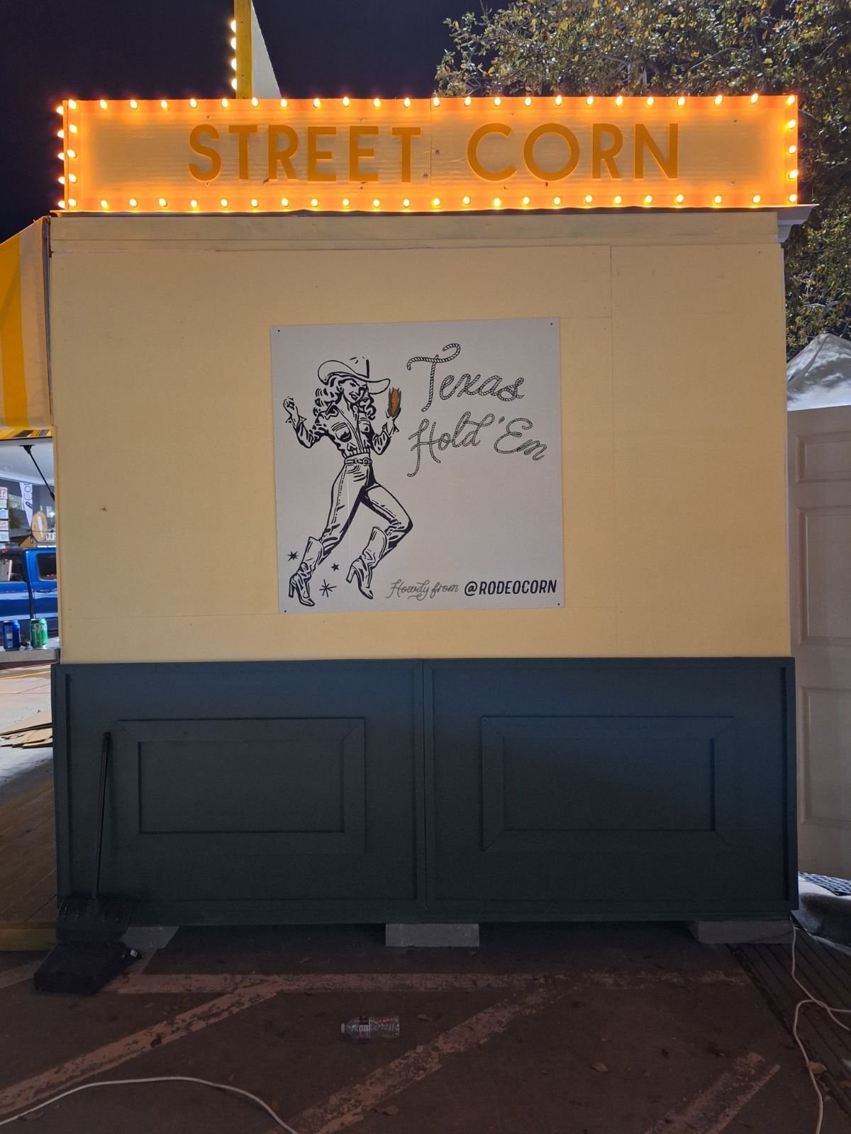 Street Corn booth at night with illuminated signage